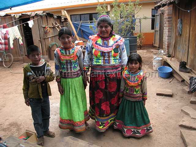 cora_family3.JPG - Village of Cora Indian with examples of town, mountains, people, costume, textiles, costume and spiritual life. This family lives in down town Santa Teresa.
